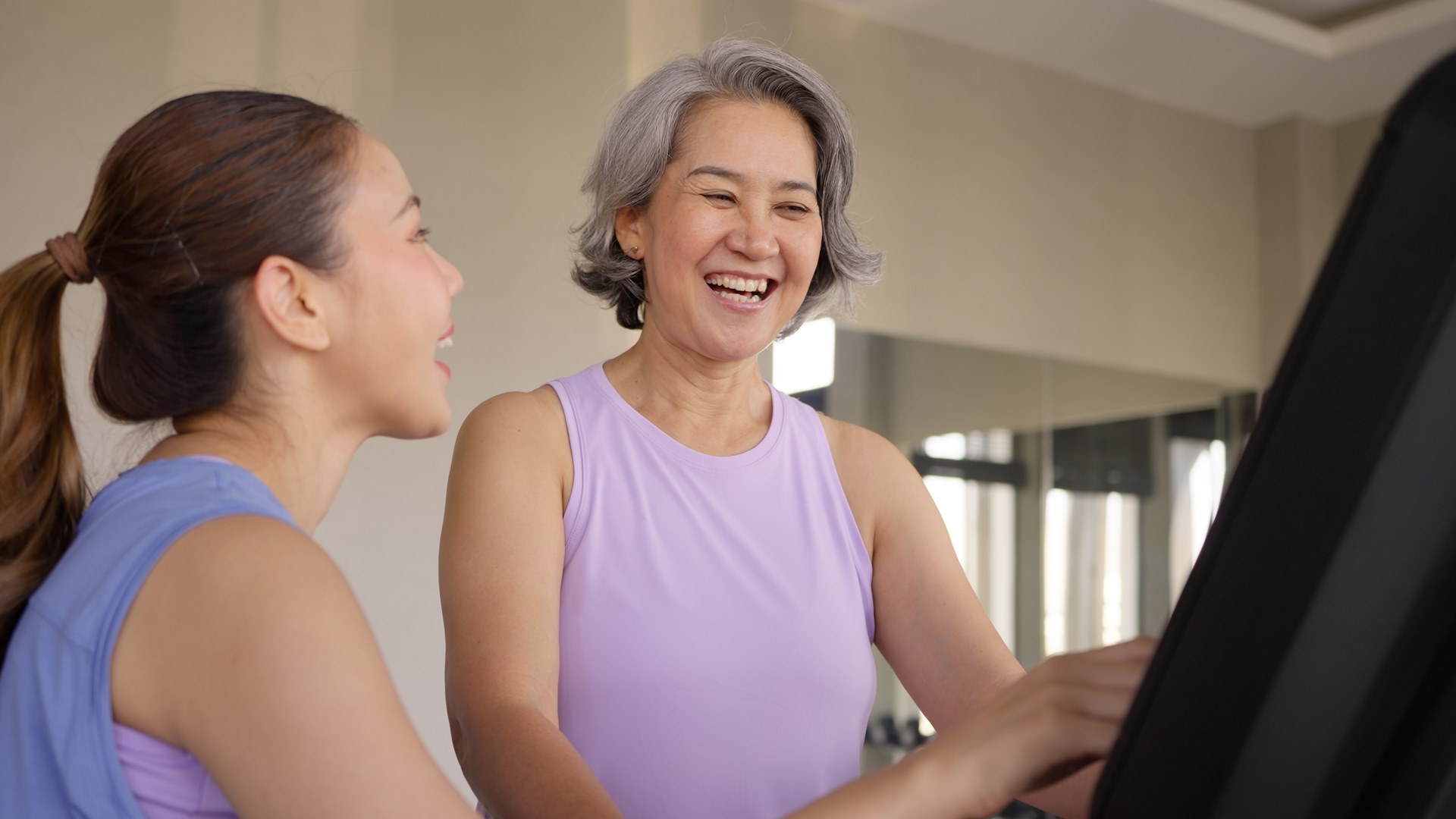 Young active adult child and mature middle age old mum run walk advice workout at gym. Love mental health care older retired mom asia elder people happy protect aging life balance enjoy sport club. Cours de yoga pour femme à Dijon